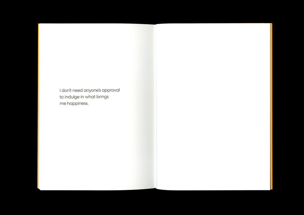 Affirmation page with the words, “I don’t need anyone’s approval to indulge in what brings me happiness,” printed in black on a white background.