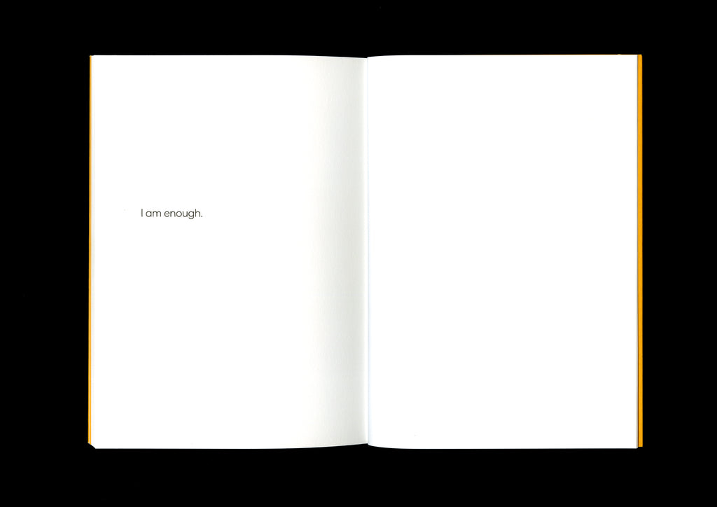 Affirmation page with the short phrase, “I am enough,” centered in black text on a white background.